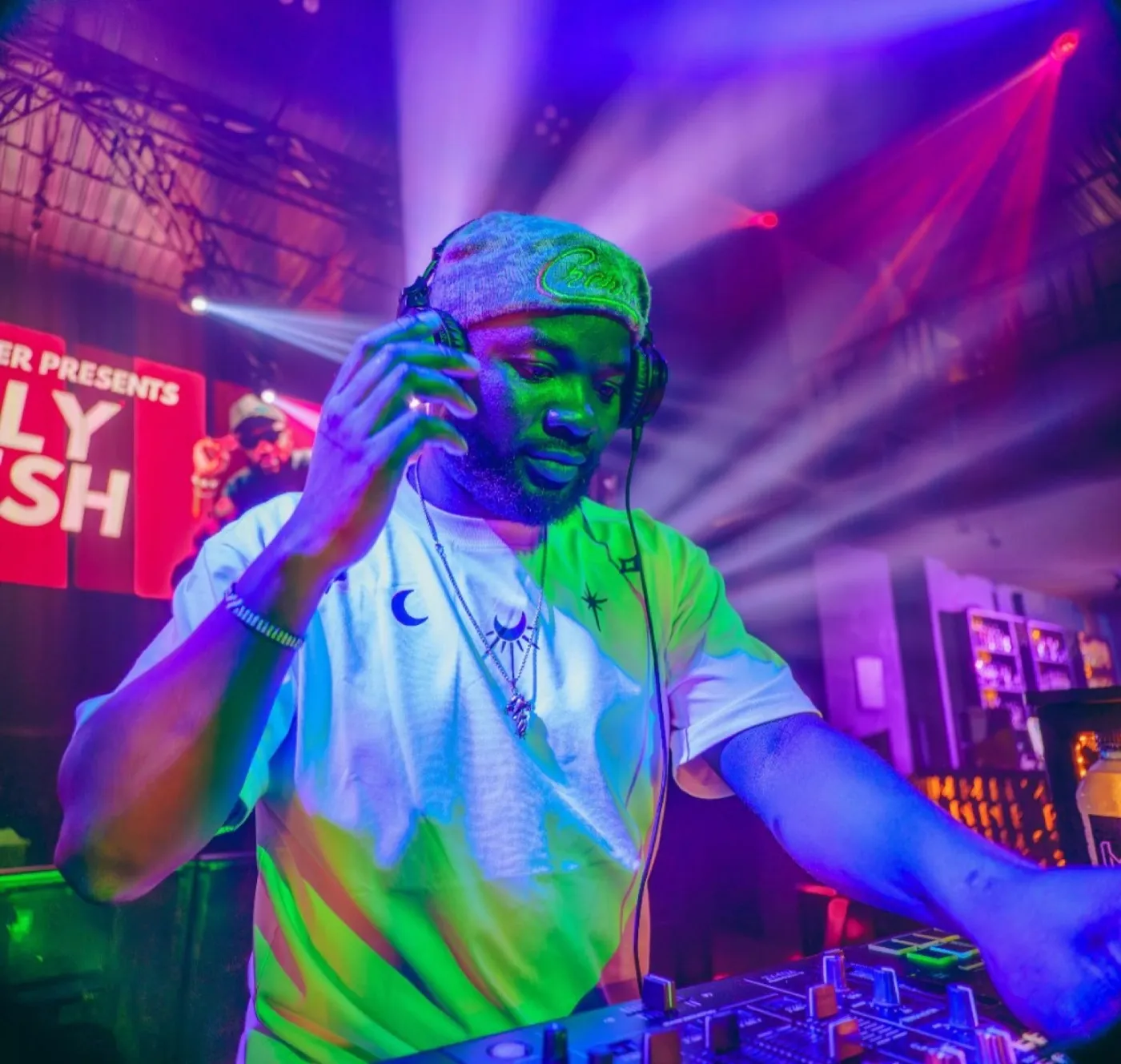 Ally Fresh DJing live under club lights