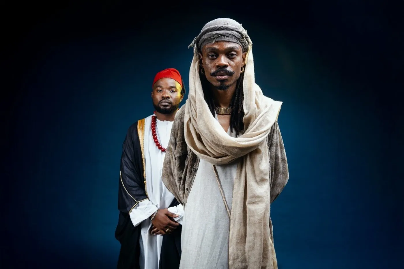 Ally Fresh in traditional attire with collaborator, studio portrait